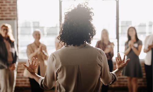 woman presenting to audience