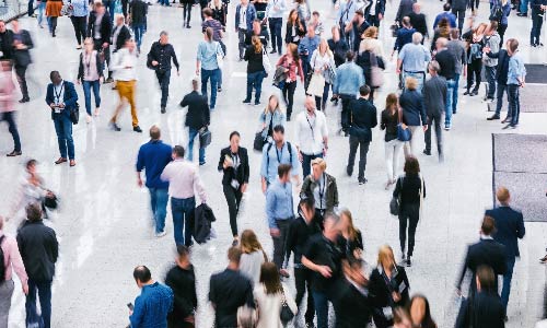 groups of people walking at a large venue