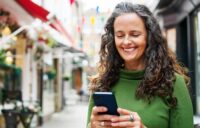 smiling woman taking an online course in her lms